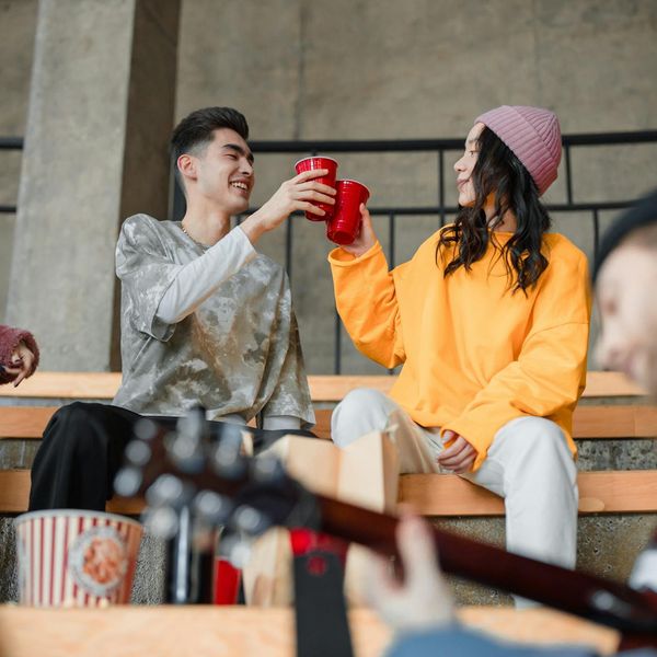 A group of people laughing together after a workout session.